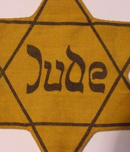 JEWISH STAR OF DAVID AS WORN IN THE GHETTO AND CONCENTRATION CAMPS HOLOCAUST